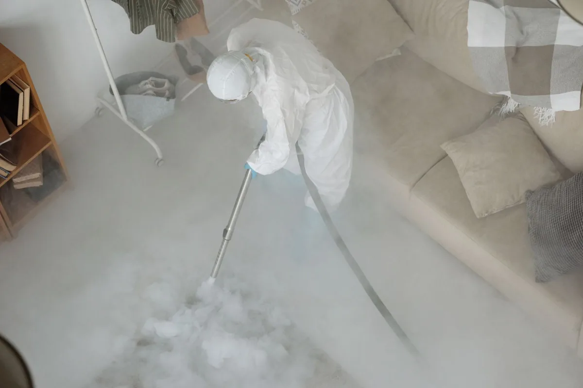 Biohazard cleanup technician in protective equipment, Sharonville, OH
